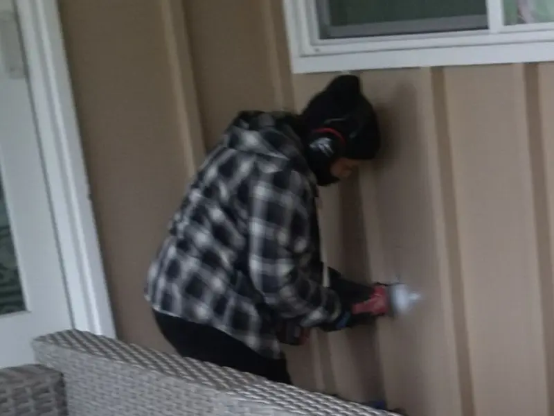 Professional electrician installing an exterior outlet in Denmark